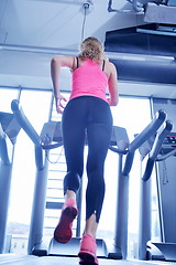 Image showing woman exercising on treadmill in gym