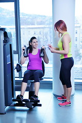 Image showing woman exercising with her personal trainer