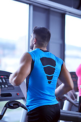 Image showing man running on the treadmill