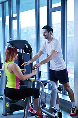 Image showing woman exercising with her personal trainer