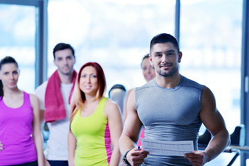 Image showing Group of people exercising at the gym