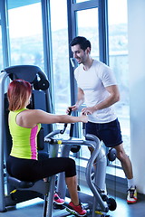 Image showing woman exercising with her personal trainer