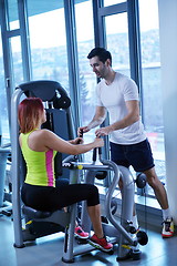 Image showing woman exercising with her personal trainer