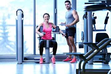 Image showing woman exercising with her personal trainer