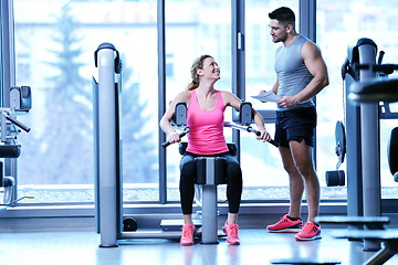 Image showing woman exercising with her personal trainer