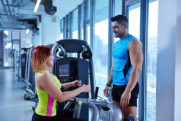 Image showing woman exercising with her personal trainer