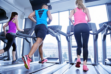 Image showing woman exercising on treadmill in gym