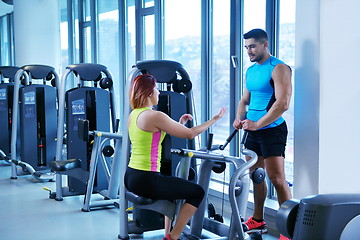 Image showing woman exercising with her personal trainer