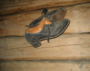 Image showing Shoes on old wall