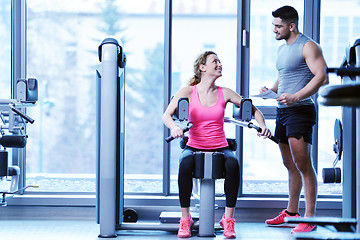 Image showing woman exercising with her personal trainer