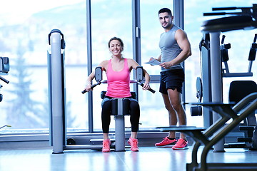 Image showing woman exercising with her personal trainer