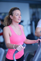 Image showing woman exercising on treadmill in gym