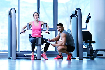 Image showing woman exercising with her personal trainer