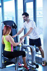 Image showing woman exercising with her personal trainer