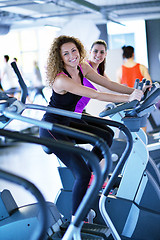 Image showing Group of people running on treadmills