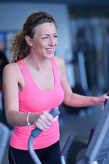 Image showing woman exercising on treadmill in gym