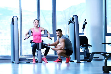 Image showing woman exercising with her personal trainer