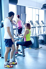 Image showing woman exercising with her personal trainer