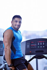 Image showing man running on the treadmill