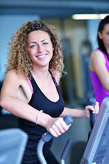 Image showing woman exercising on treadmill in gym