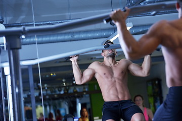 Image showing handsome man exercising at the gym