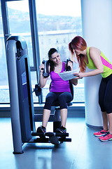 Image showing woman exercising with her personal trainer