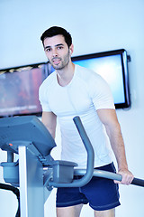 Image showing man running on the treadmill