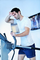 Image showing man running on the treadmill