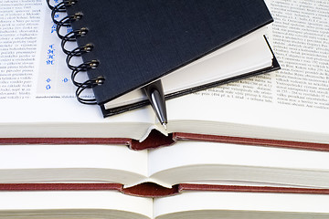 Image showing Notebook and Pen on Books