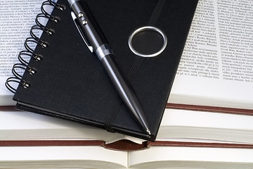 Image showing Notebook and Pen on Books