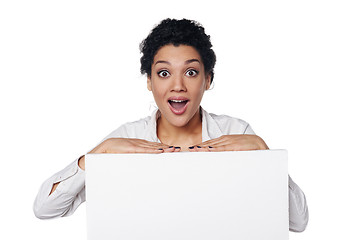 Image showing Surprised business woman showing blank credit card