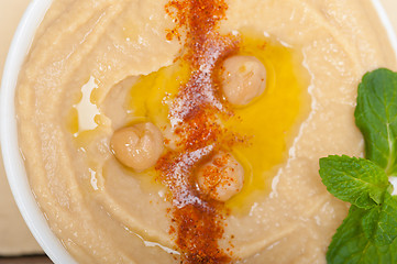 Image showing Hummus with mint on top