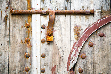 Image showing brown  morocco in  the old wood    rusty safe padlock 