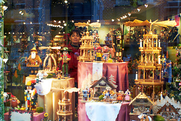 Image showing Woman look through Showcase toy shop Bruges. Belgium