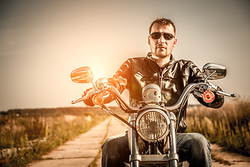 Image showing Biker on a motorcycle