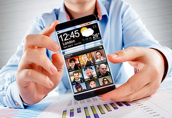 Image showing Smartphone with transparent screen in human hands.