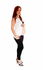 Image showing Pregnant woman holding belly.