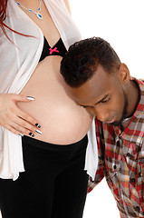 Image showing Man listening on baby belly.