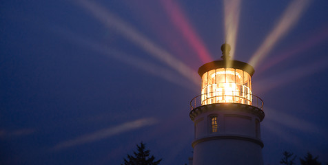 Image showing Lighthouse Beams Illumination Into Rain Storm Maritime Nautical 