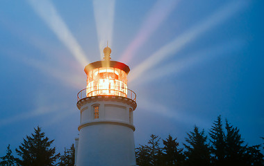 Image showing Lighthouse Beams Illumination Into Rain Storm Maritime Nautical 