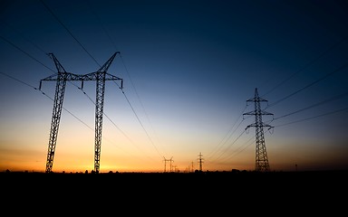 Image showing Large transmission towers at blue hour 