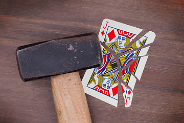 Image showing Hammer with a broken card, jack of diamonds