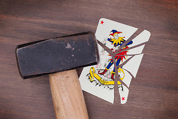 Image showing Hammer with a broken card, joker