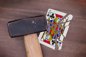 Image showing Hammer with a broken card, jack of clubs