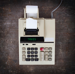 Image showing Old calculator - taxes