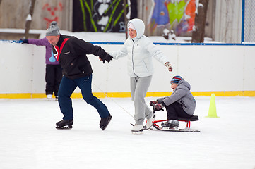 Image showing Happy family with a sledge