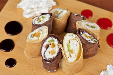 Image showing pancake roll with marmalade