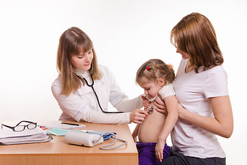 Image showing Pediatrician listening to baby's breath stethoscope