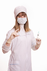 Image showing Health worker in a mask with syringe and ampoule