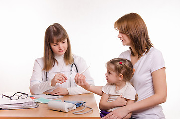 Image showing Little girl with her mother at a reception at the pediatrician